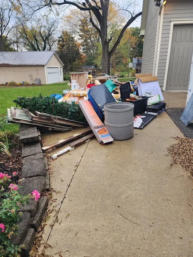 Dumpster being loaded with debris for 30 Yard Dumpster Rental in Enochville